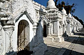 Myanmar - Mandalay, Kuthodaw Pagoda. 729 white pitaka pagodas contain the Tipitaka, the sacred texts of Theravada Buddhism. 